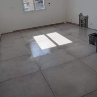 Pose d'un carrelage 90x90 sur un ancien carrelage - Après